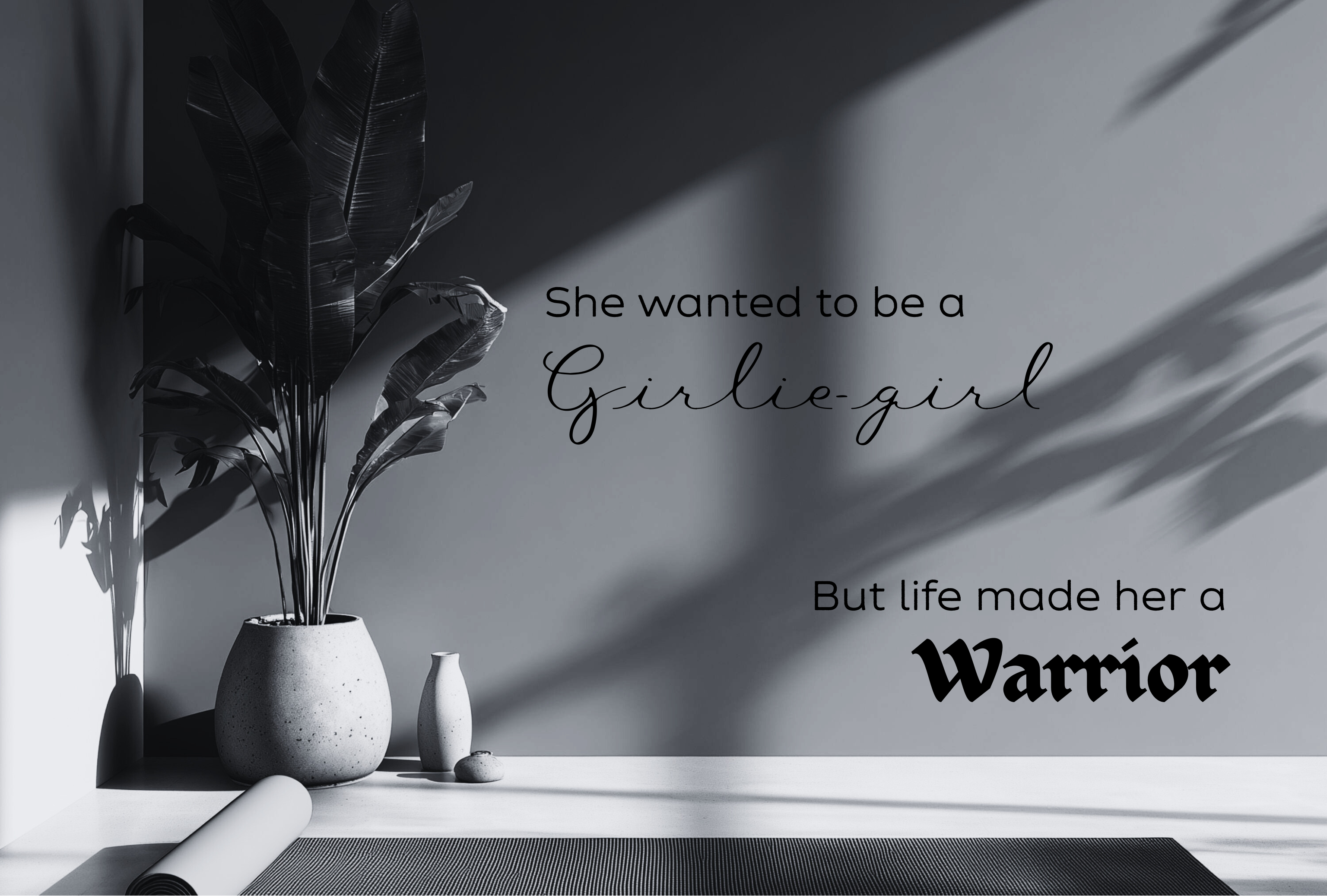 Black and white room interior with a plant, vase, and motivational quote on the wall.